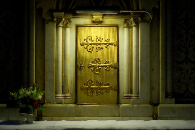 An ornate door leading to a secret meeting place