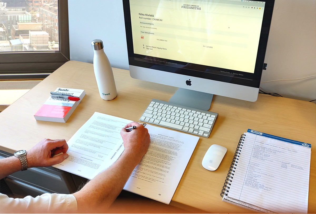 [Image: a student writing in a study journal]